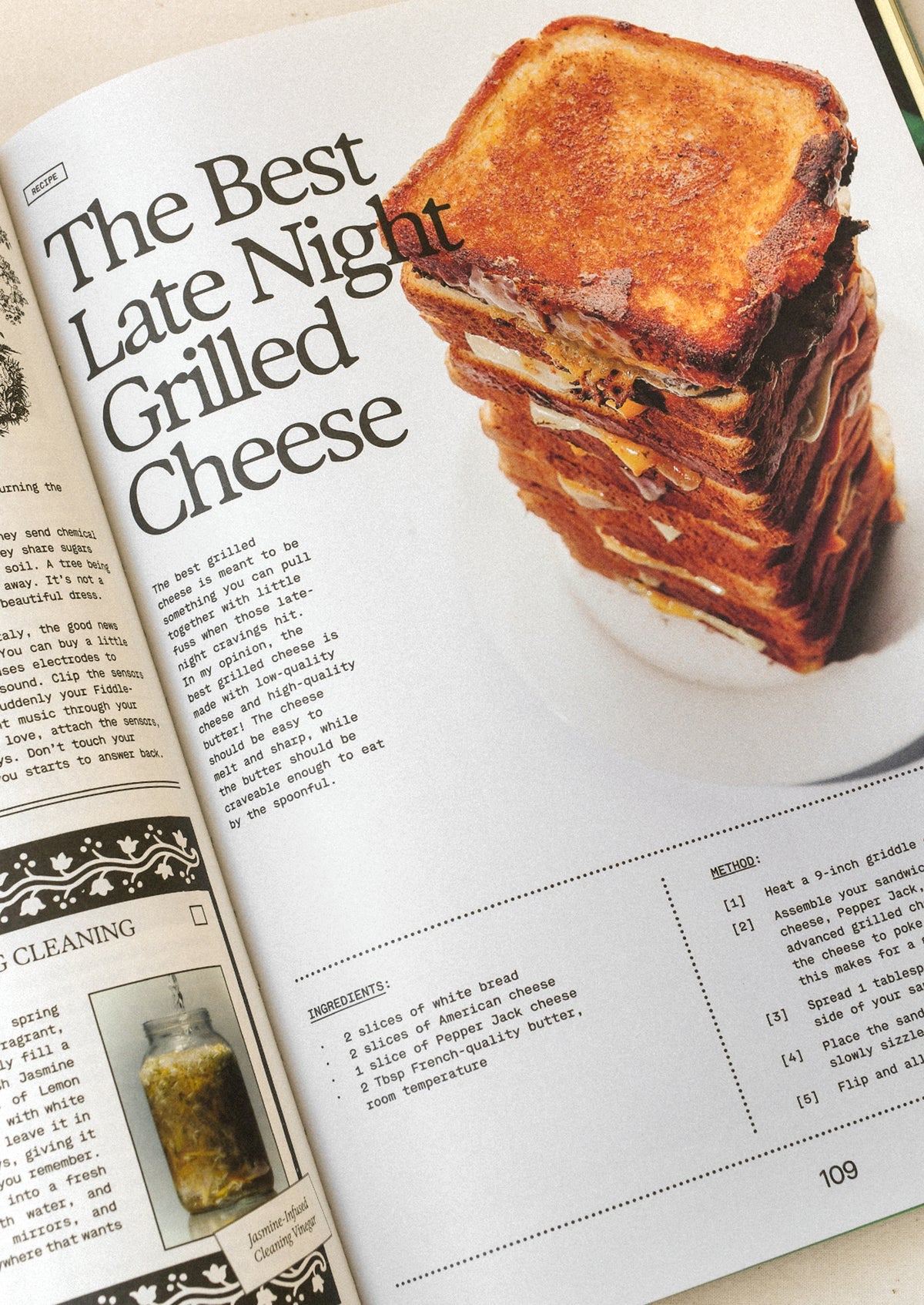 A book open on a table with a recipe for "The best late night grilled cheese".