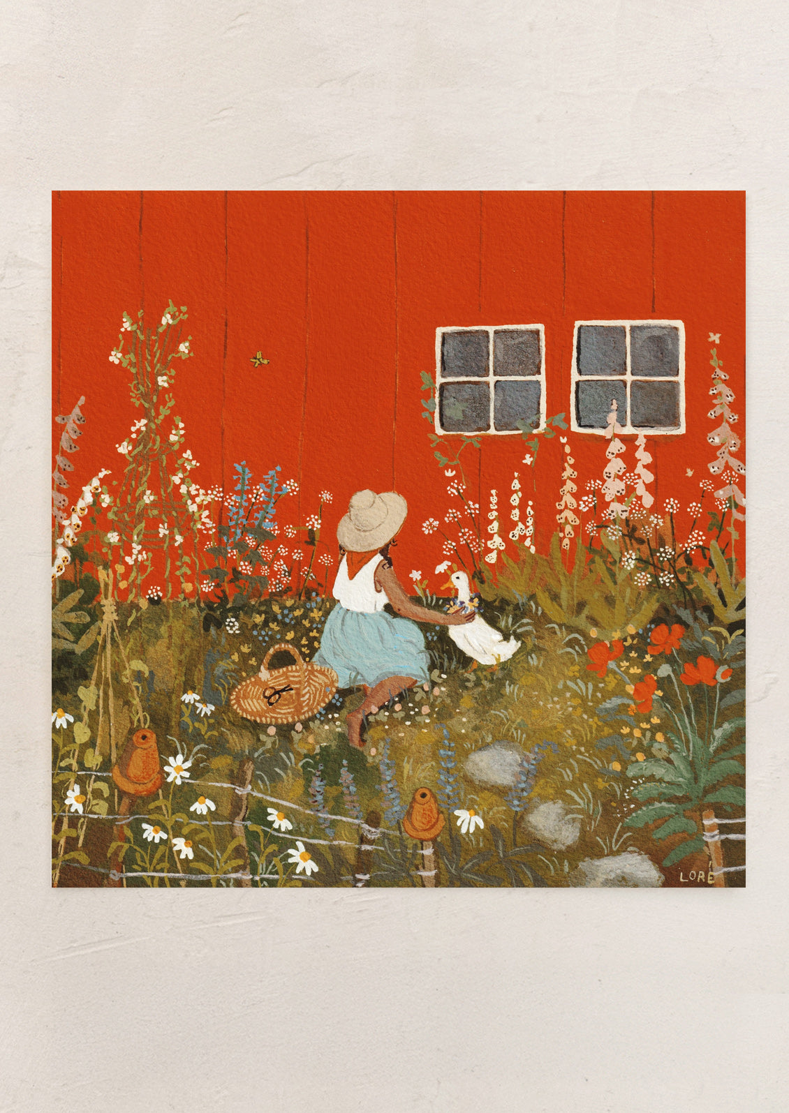 An art print of a woman sitting next to a red barn, petting a goose among flowers.