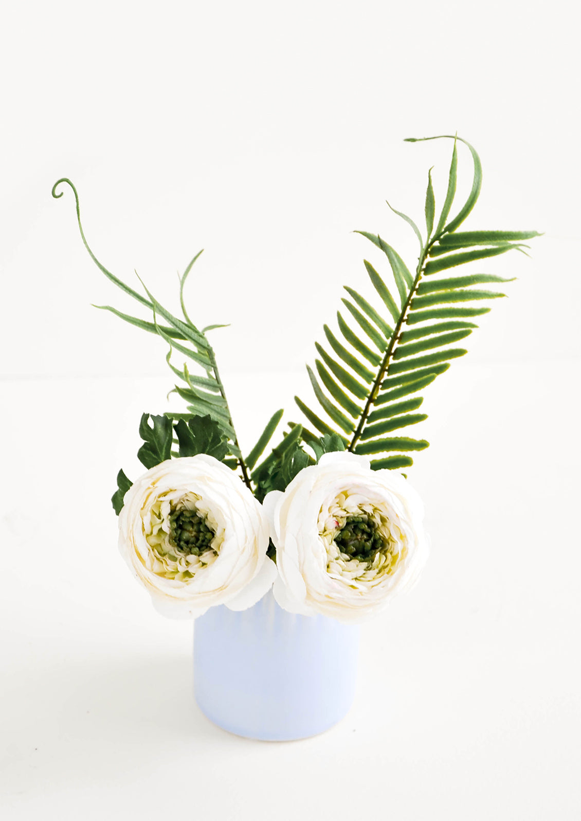 Mini Ceramic Vase in Periwinkle Blue with Groove Detailing shown with flowers - LEIF