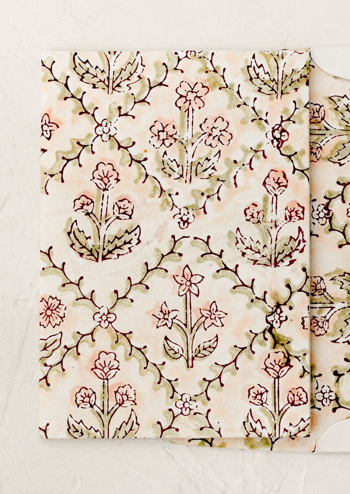 A block printed floral card with matching lined envelope in peach colorway.