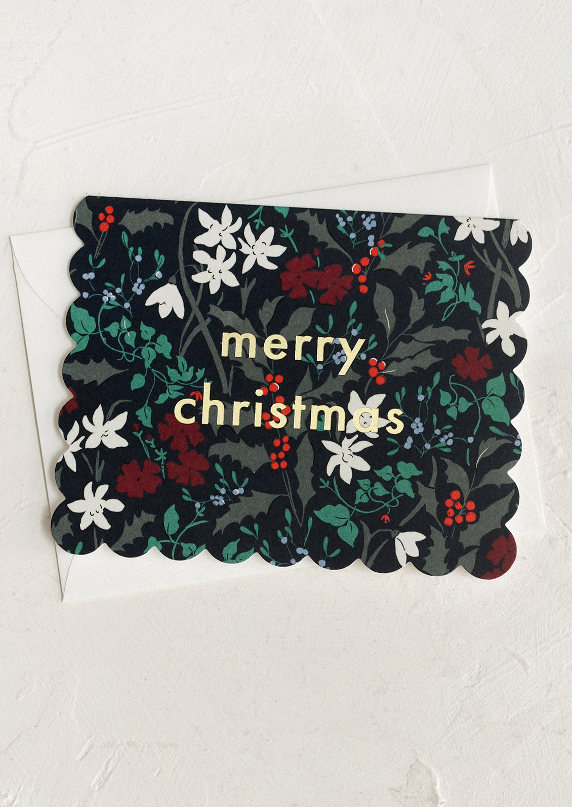 Floral Christmas card with 'merry christmas' text on a white background
