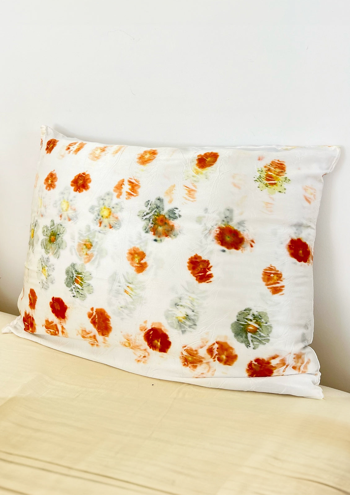 White silk pillowcases dyed in cosmos bundle dye pattern.