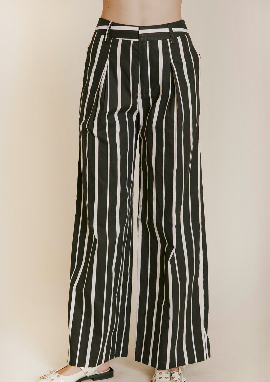 A pant of black and white striped pants.