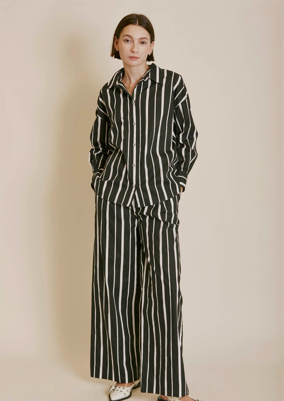 A pant of black and white striped pants.