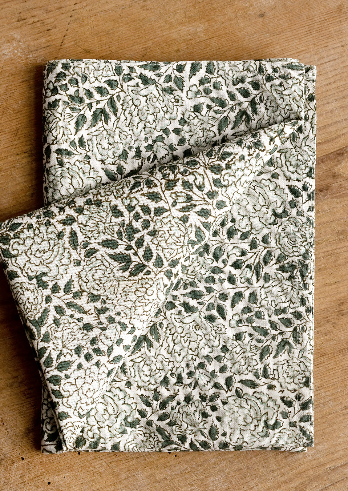 An ivy floral print cotton tea towel.