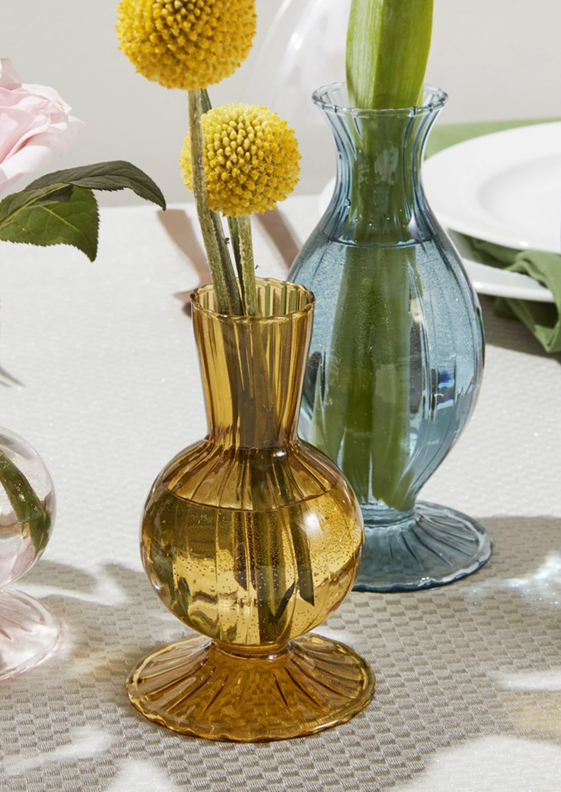 A fluted glass vase in amber.