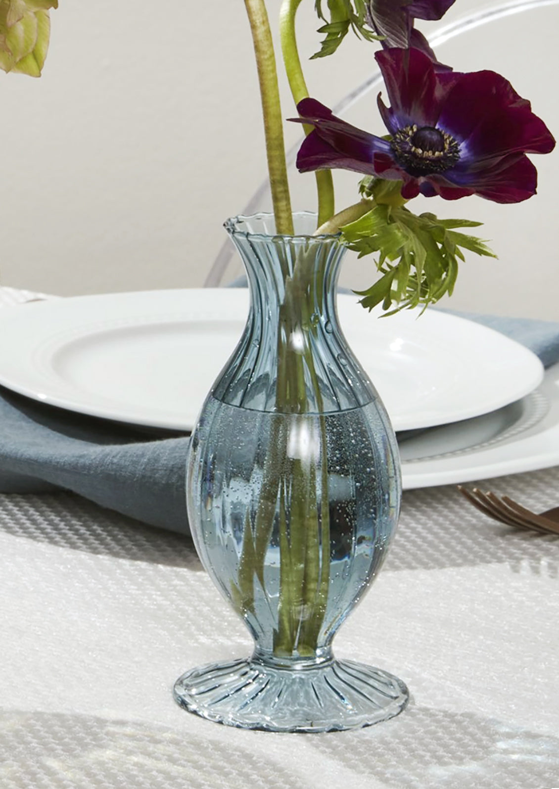A fluted glass vase in blue.