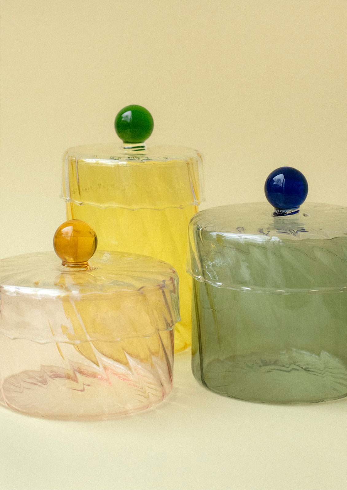 Swirl glass colorful jars in assorted colors.