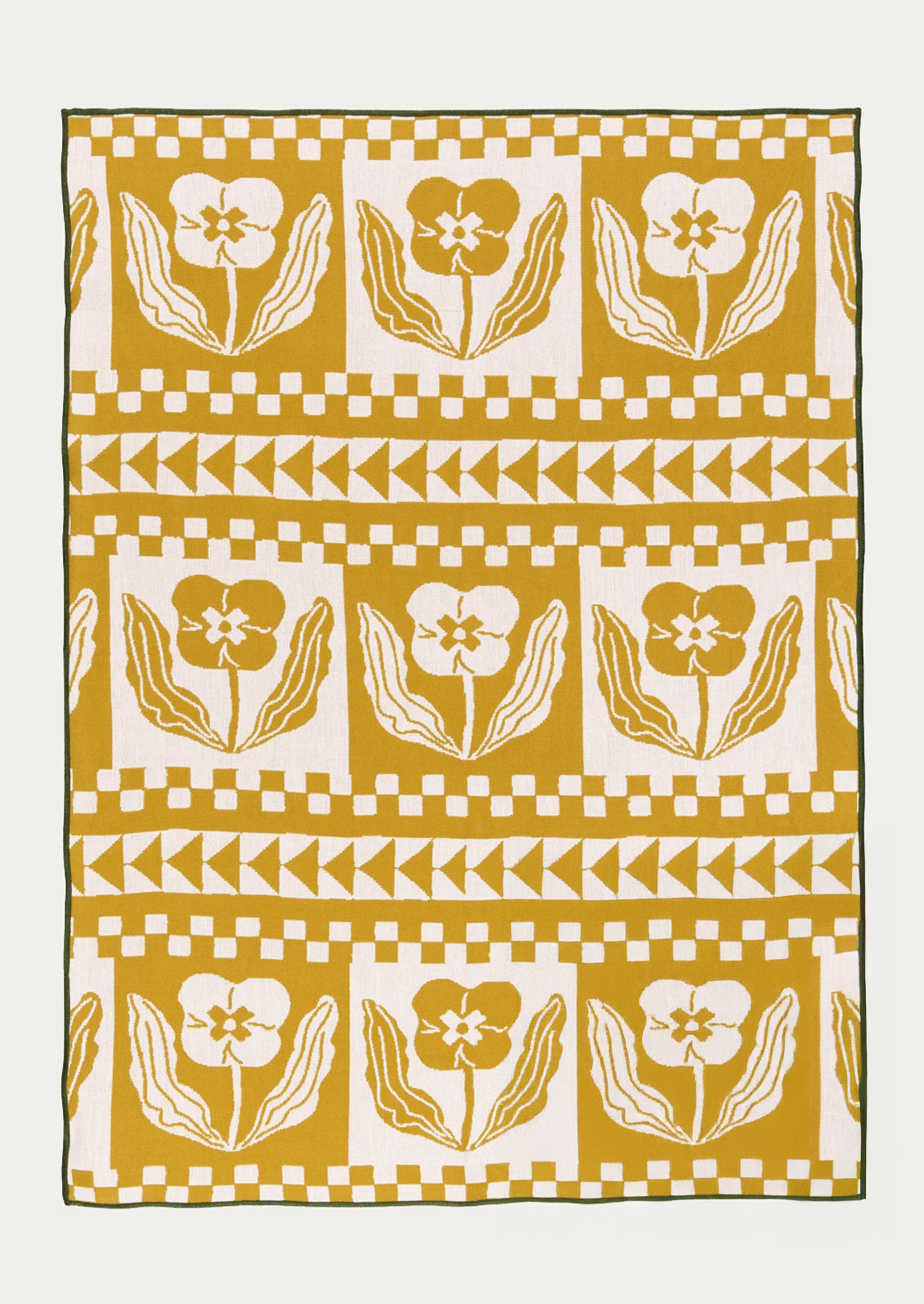 Patterned fabric tea towel with floral and geometric design on a white background