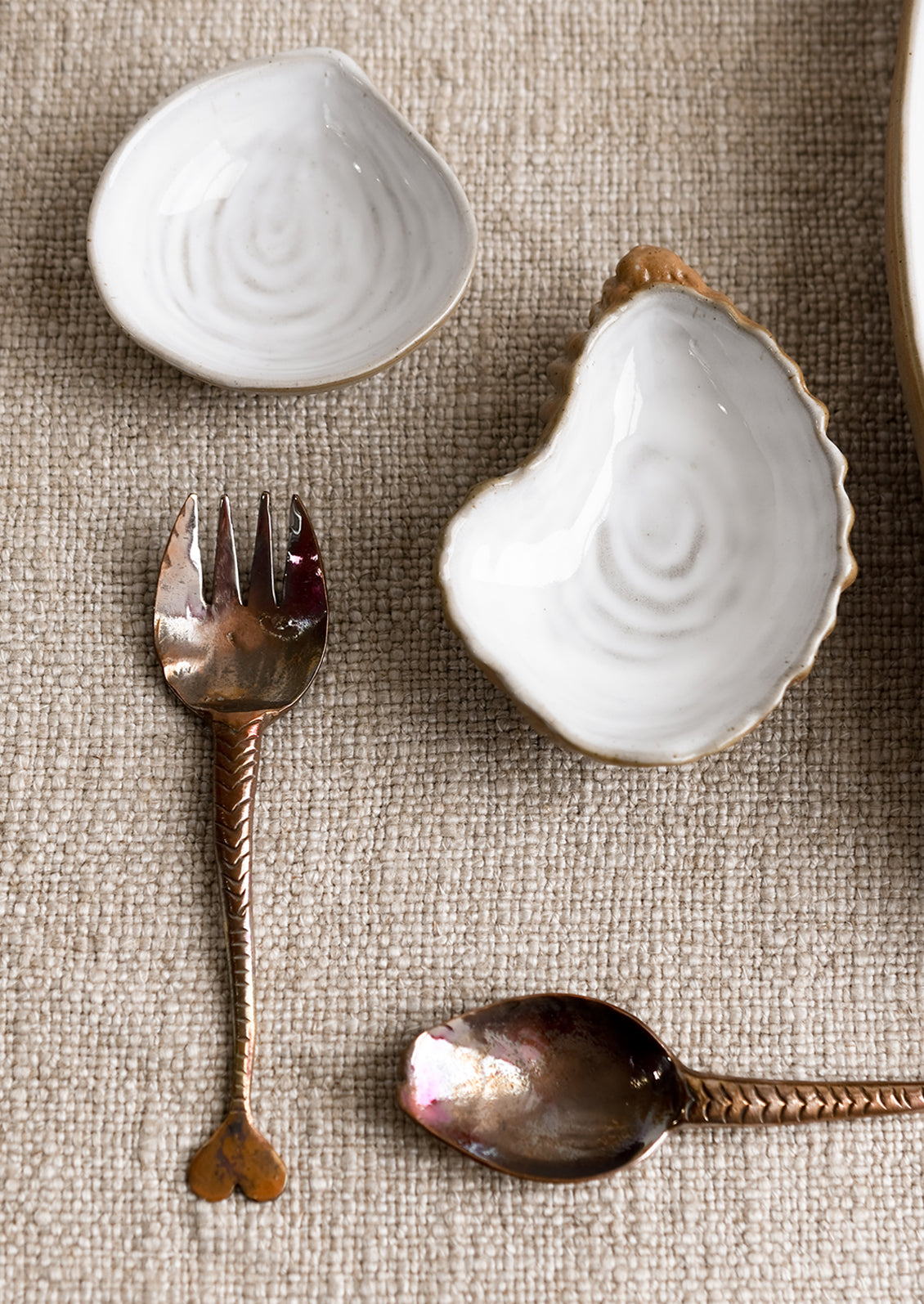 Copper utensils and shell shaped ceramics.