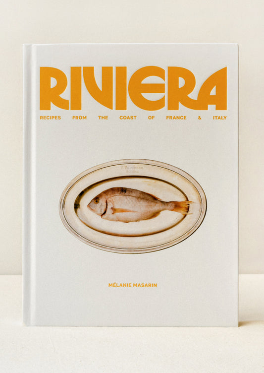 A cookbook titled 'Riviera - Recipes from the Coast of France & Italy' by Melanie Masarin.