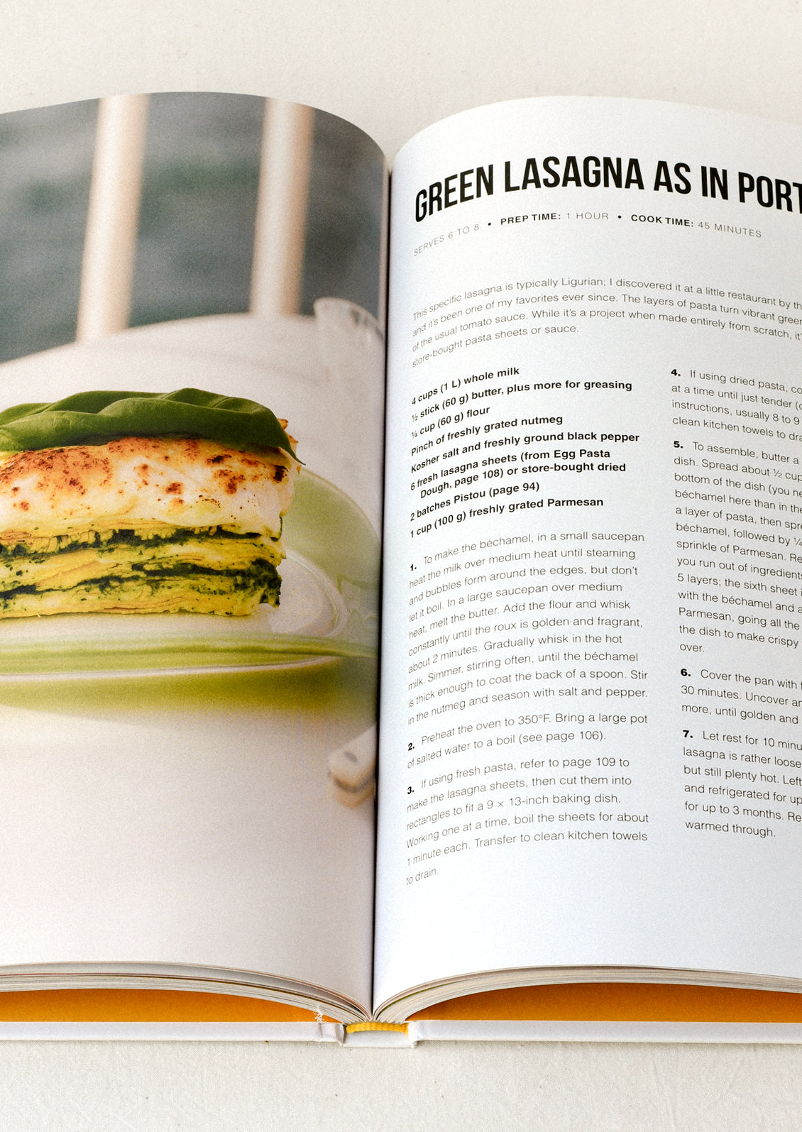An open cookbook with a recipe for green lasagna.