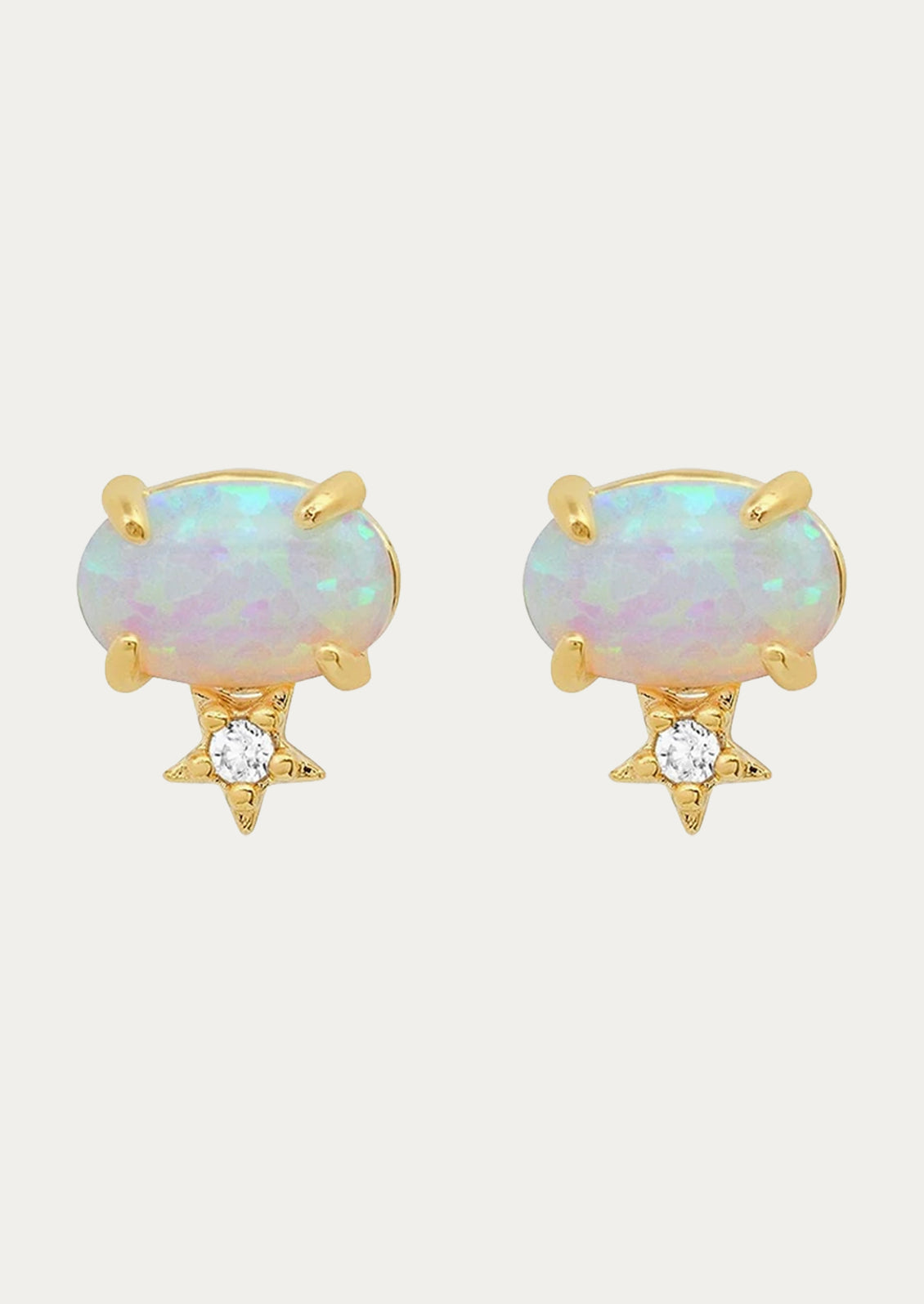 A pair of opal stud earrings with a star underneath.