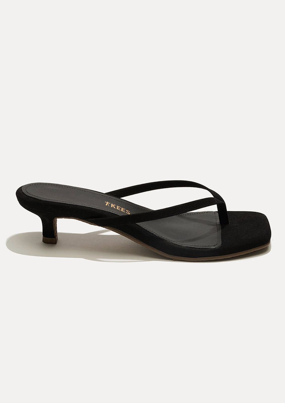 A black suede kitten heel sandal with a square toe by TKEES.