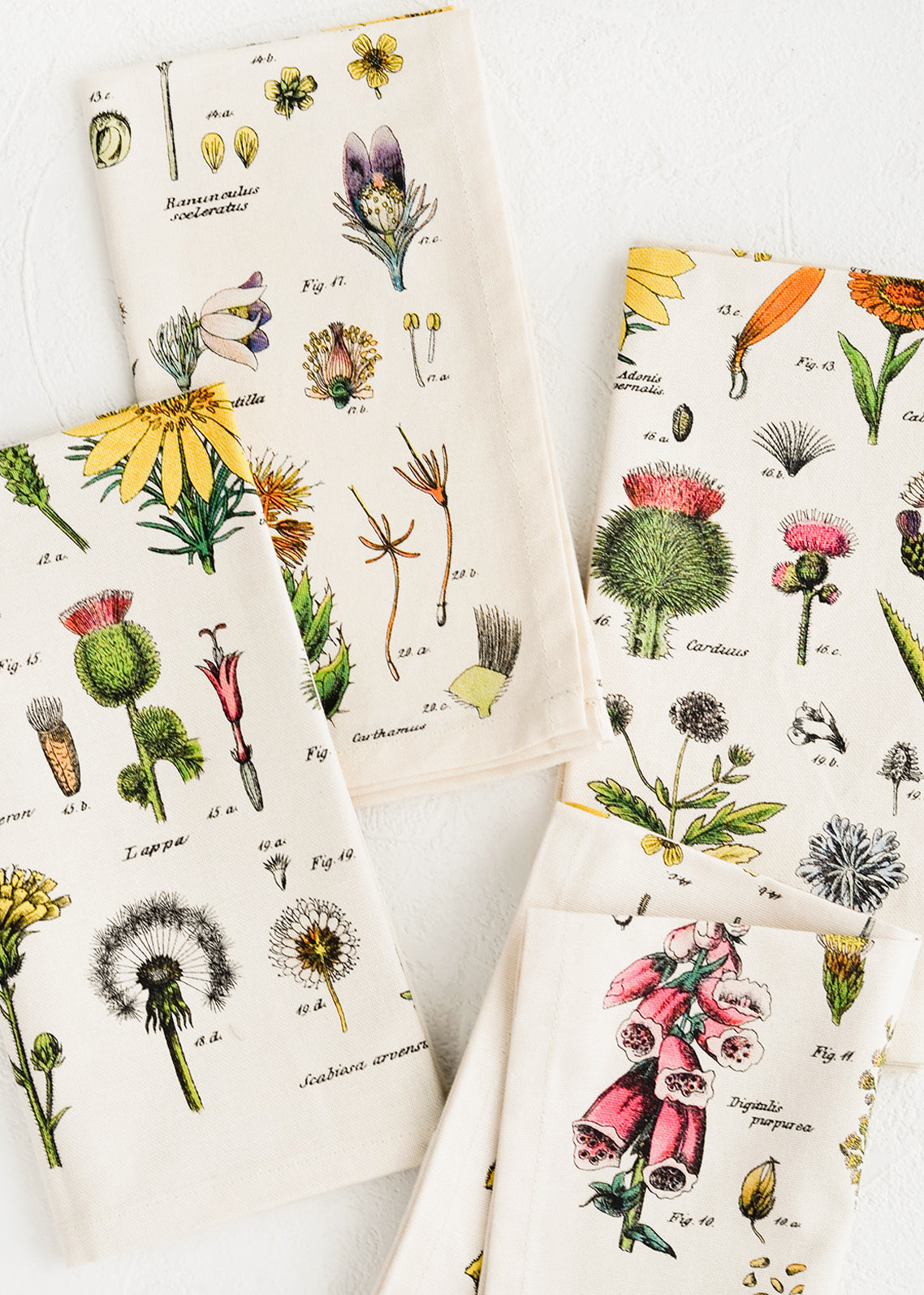 A set of four cotton napkins with colorful botanical wildflower print.