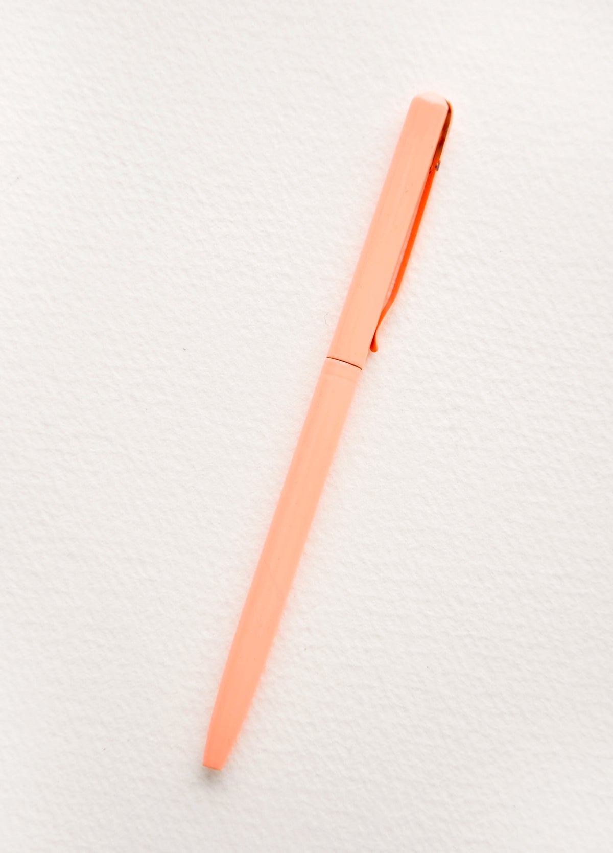 Slim pen in peach color. 