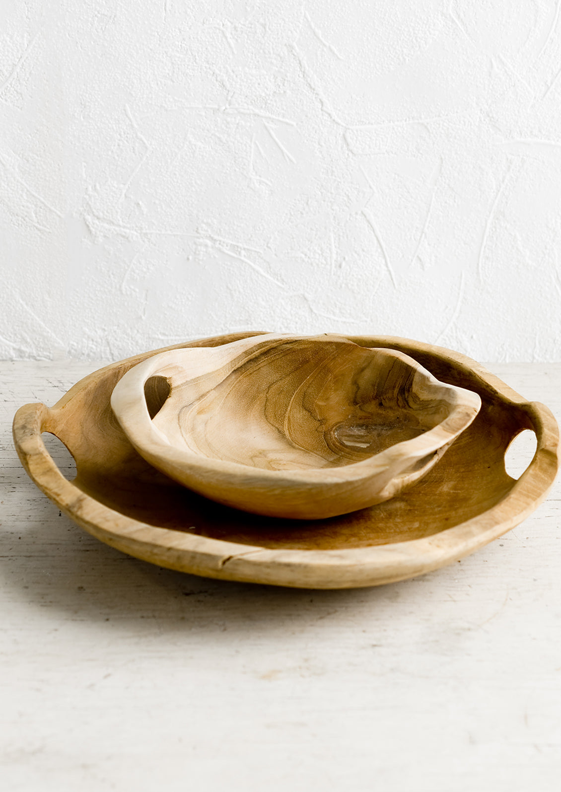 Two teakwood bowls.
