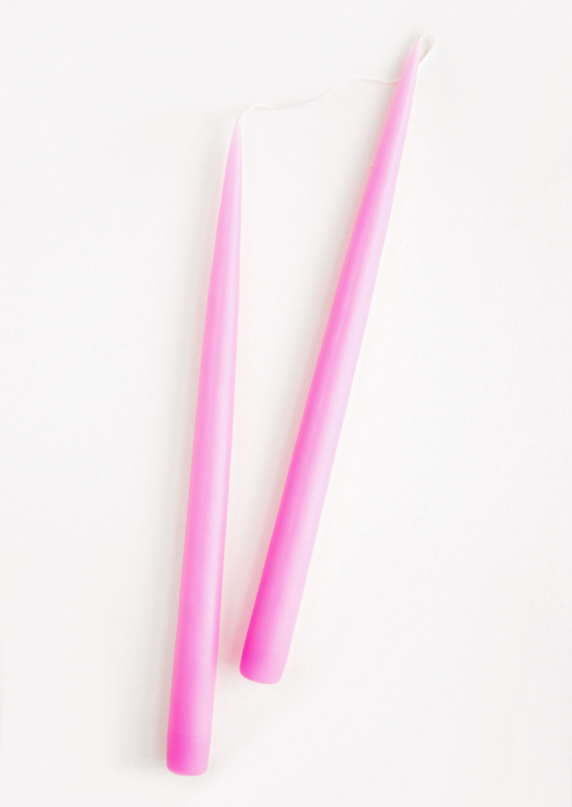 Pair of Taper Candles in bright pink.