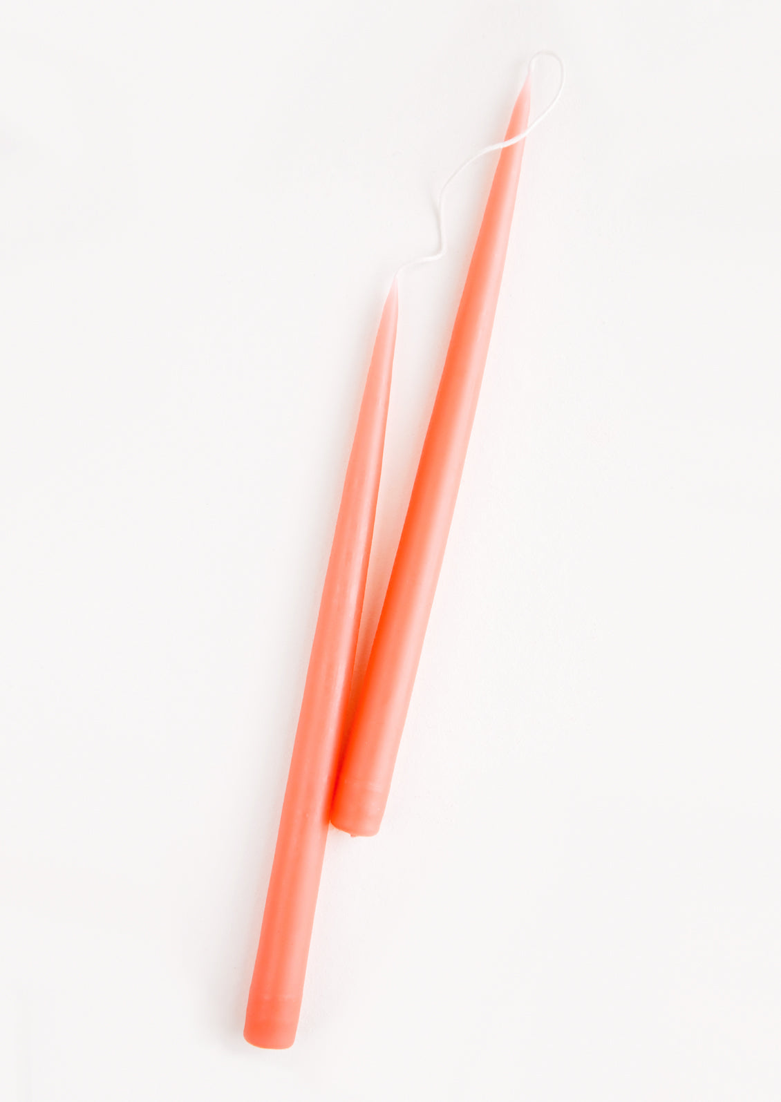 Pair of Two taper Candles in coral peach.