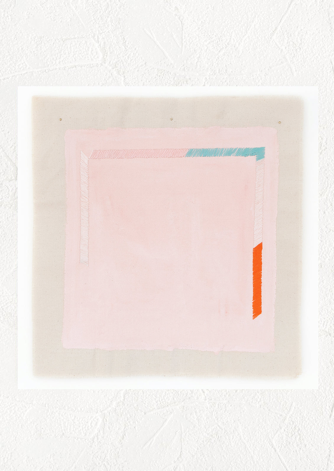 A minimalist abstract print of a pale pink square with small sections of blue, white, and red near its edges.