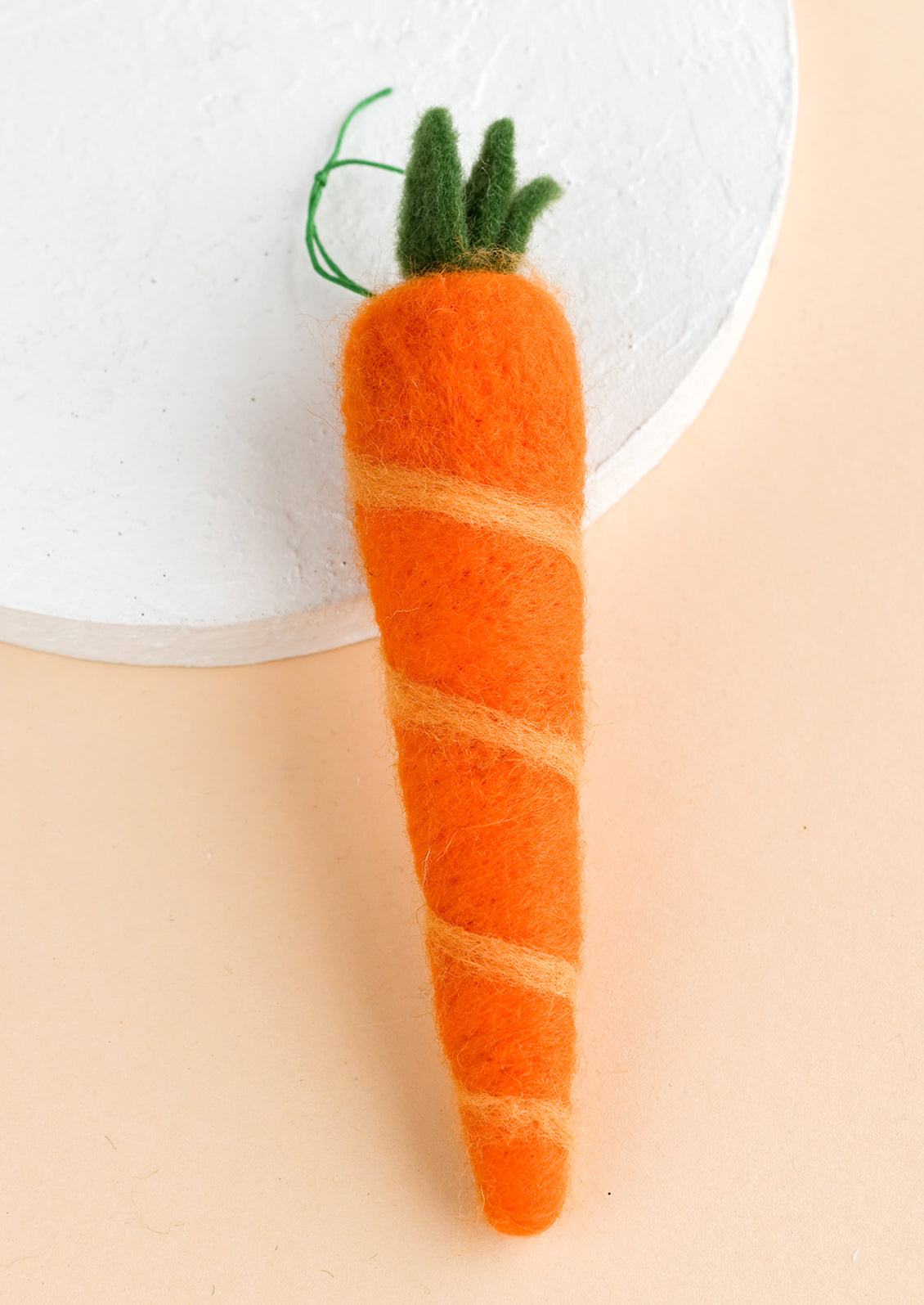 A felted ornament of a carrot.