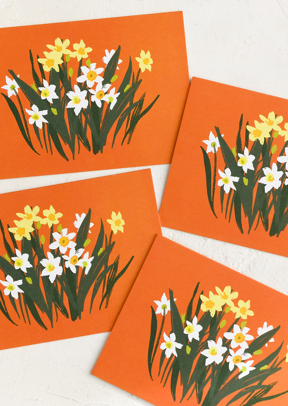 A set of red paperwhite printed greeting cards.