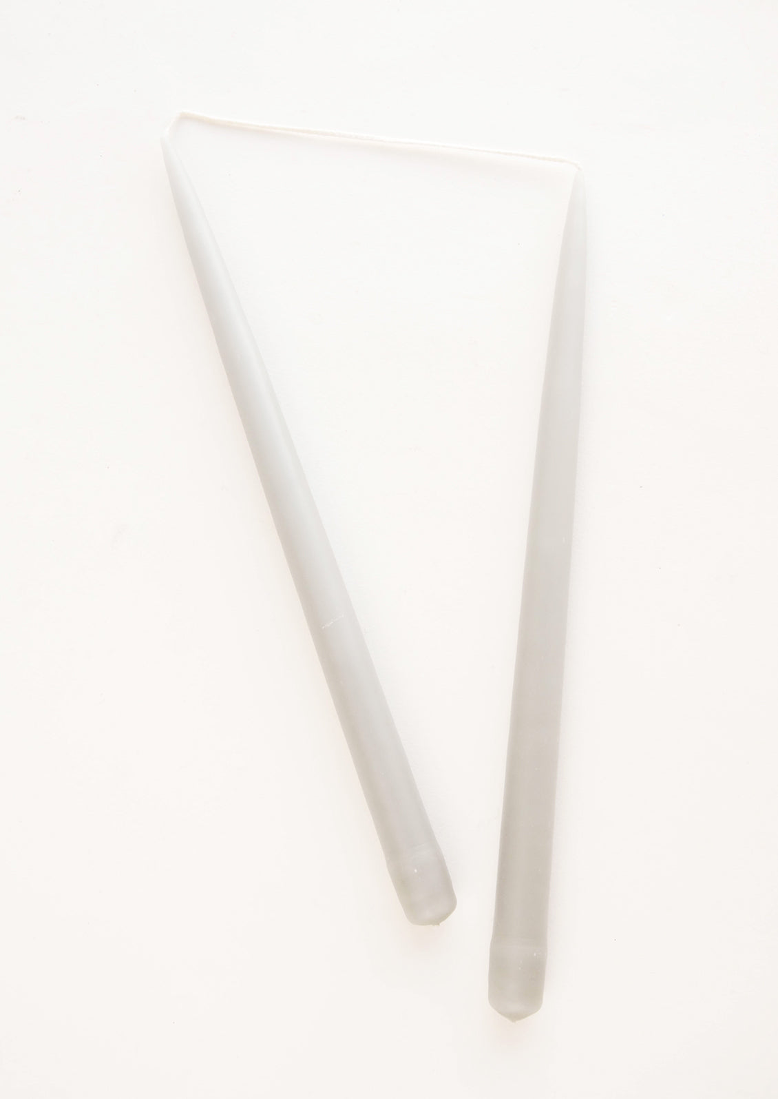 Pair of Taper Candles in mid grey.