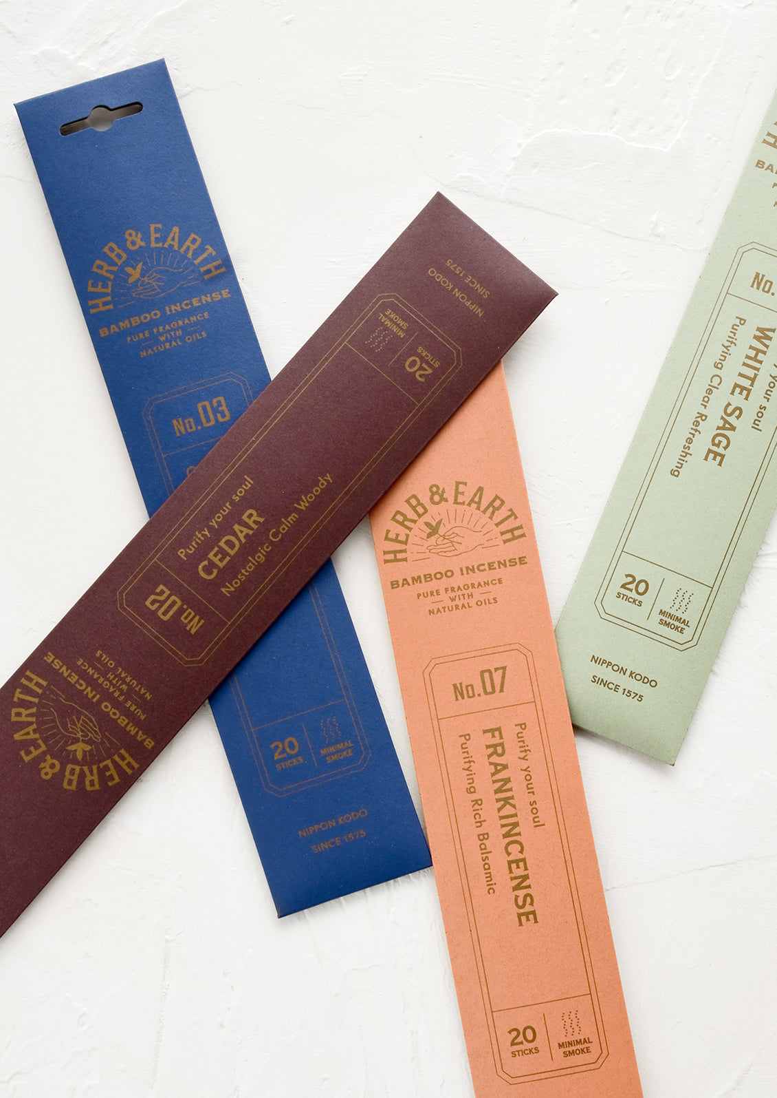 Colorful, scattered unopened packages of incense.