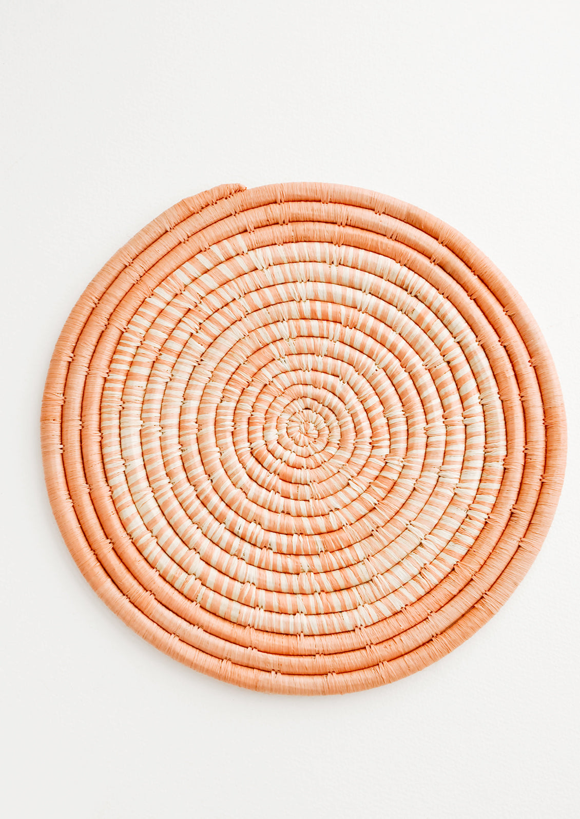 Hue Woven Raffia Trivet in Peach - LEIF