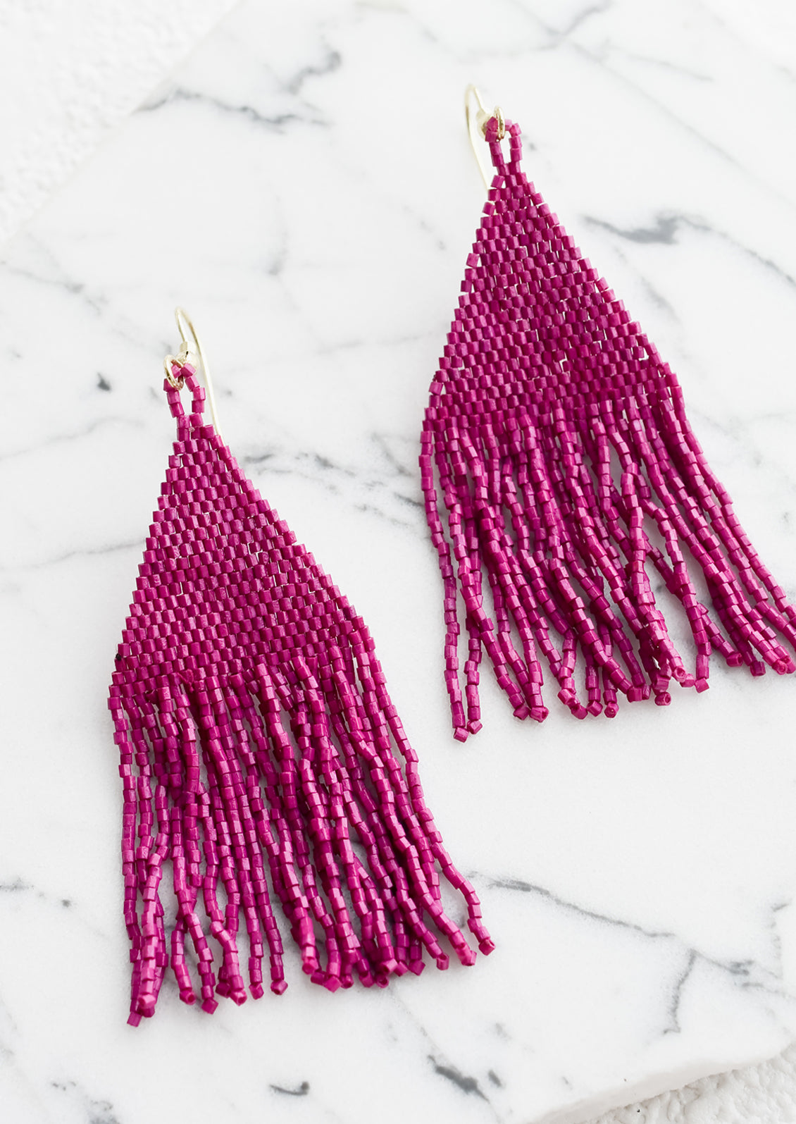 Metallic magenta triangular fringe beaded earrings.