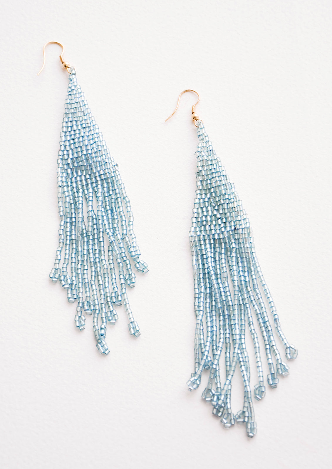 Light blue iridescent beaded fringe earrings.