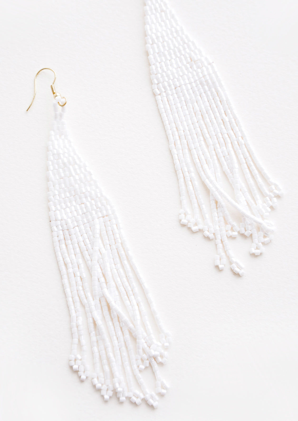 True white iridescent beaded fringe earrings. 