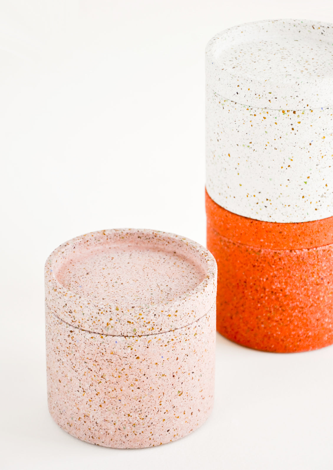 Stack of Colored Concrete Storage Jars with Speckled Glass Flecks