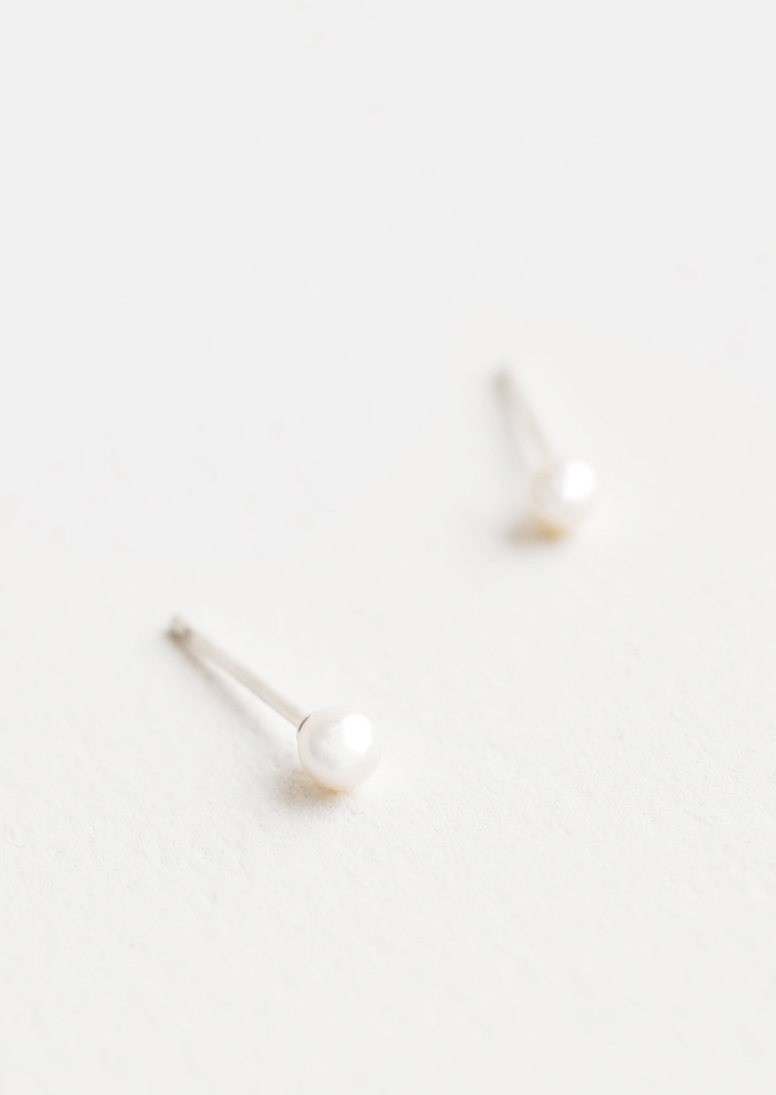 Tiny Pearl Stud Earrings in  - LEIF