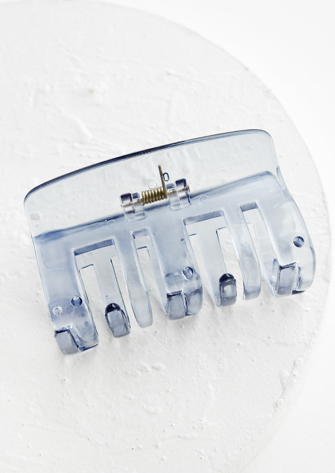 A transparent hair clip in blue.