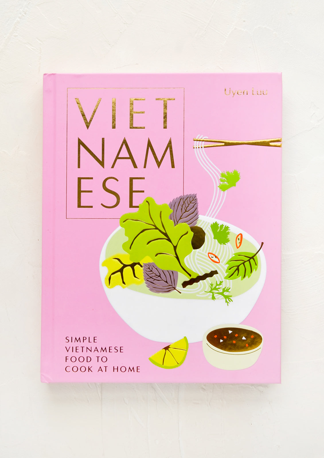 Pink hardcover cookbook titled "Vietnamese: Simple Vietnamese Food To Cook At Home".